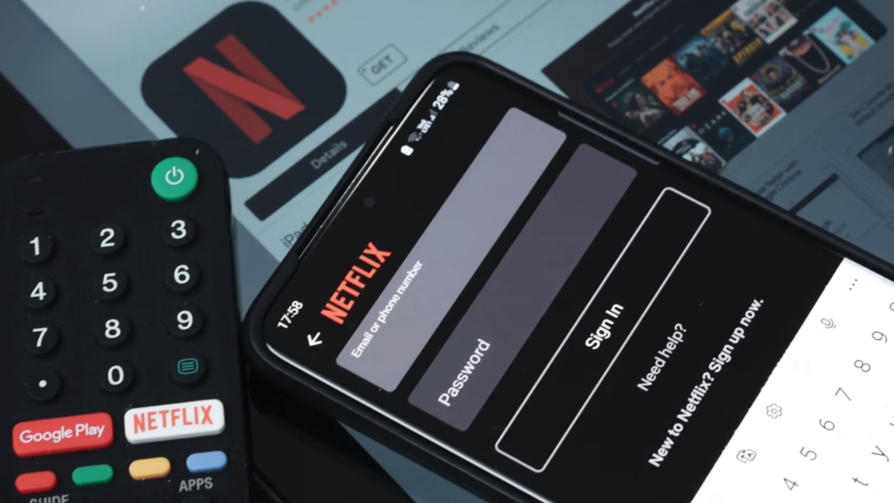 A smartphone shows the Netflix sign-in screen beside a TV remote with a Netflix button.
